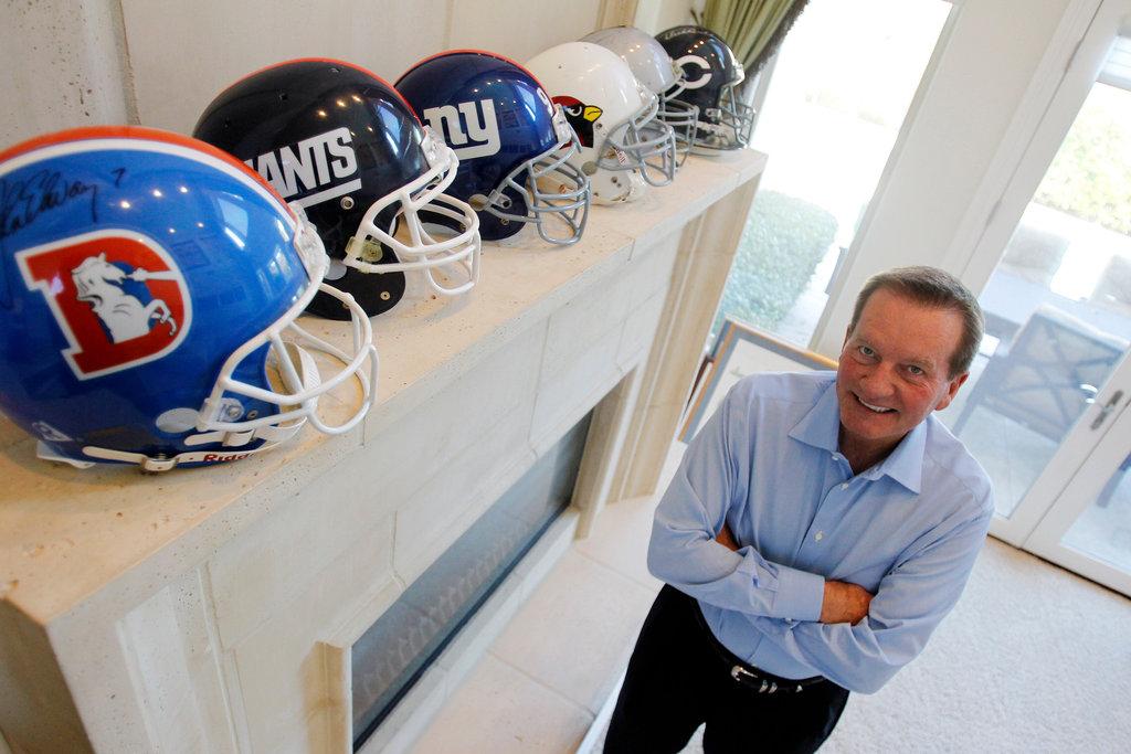 Jim Fassel With His Helmets