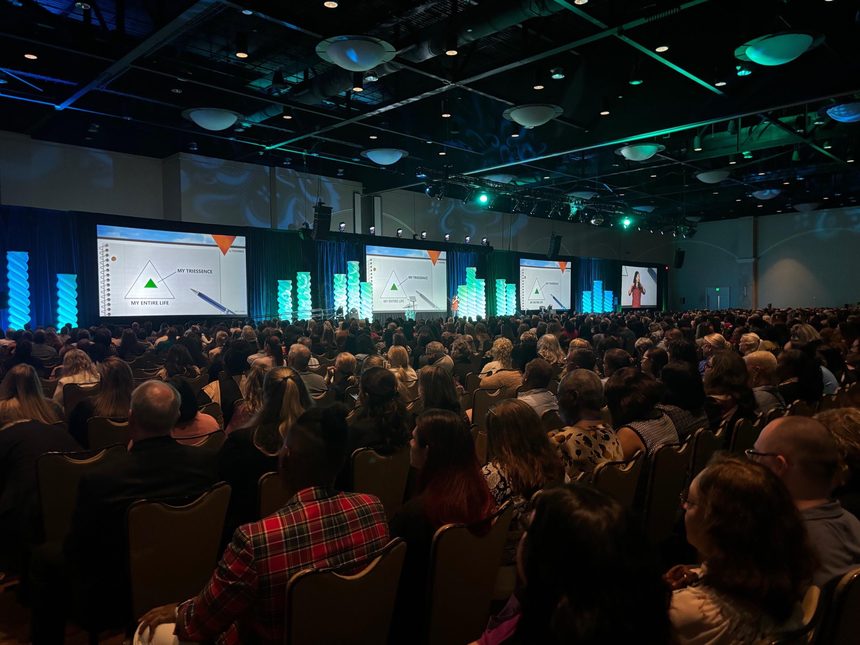 Tessa Todd Morgan speaking to large corporate audience