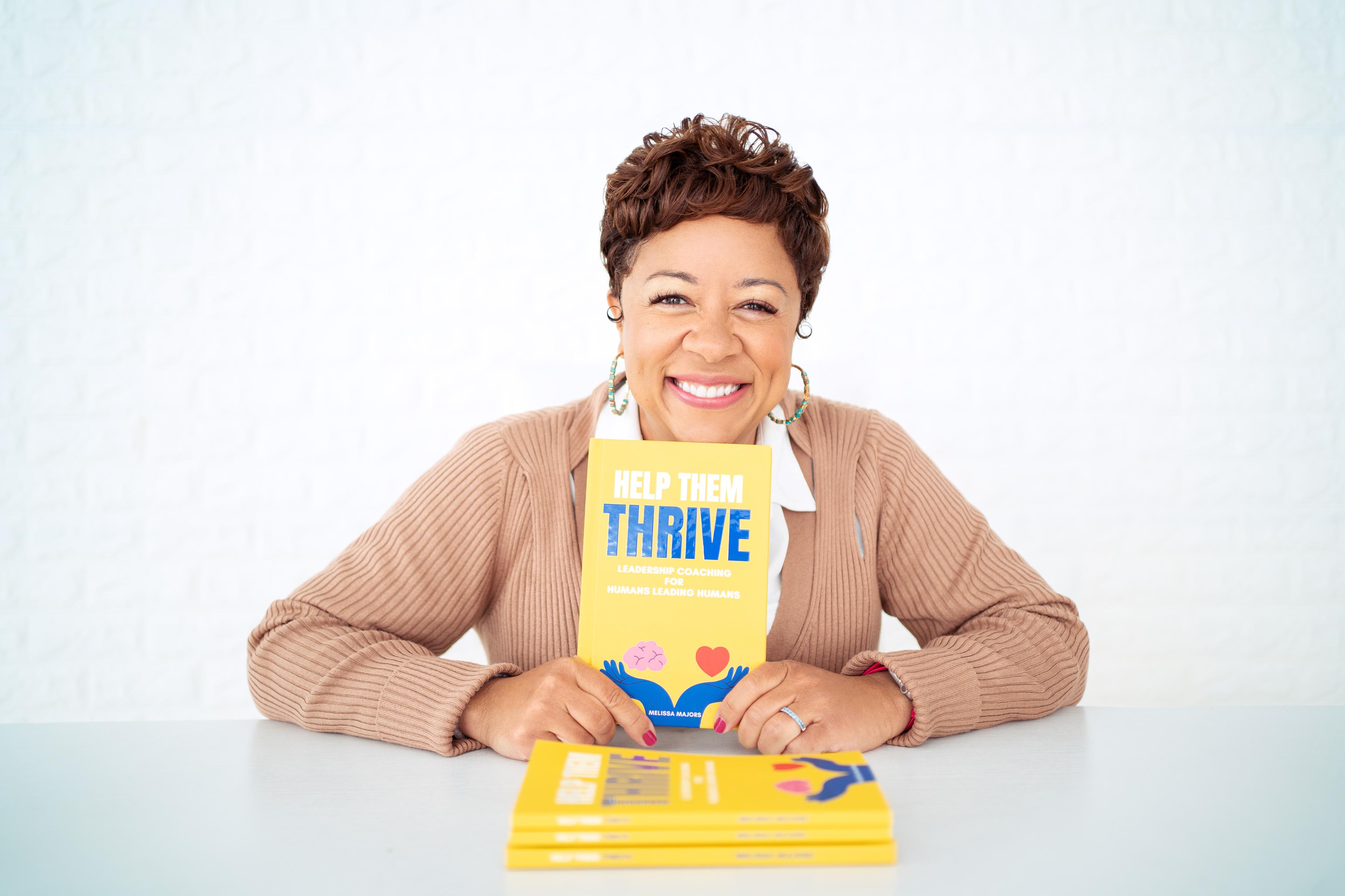 Melissa with book Help Them Thrive